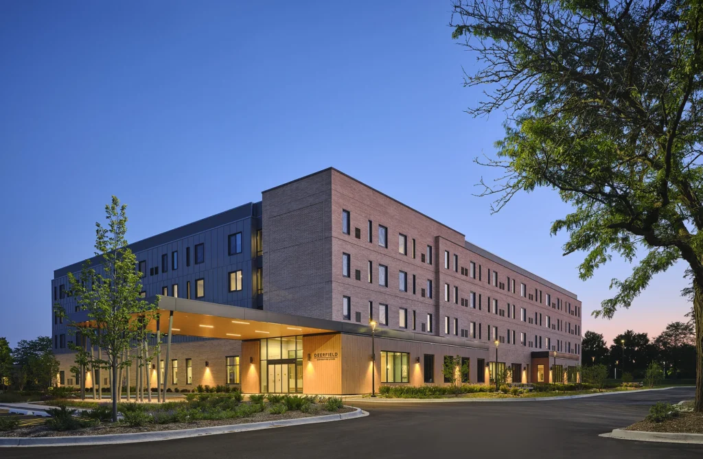 Deerfield Supportive Living building exterior at dusk